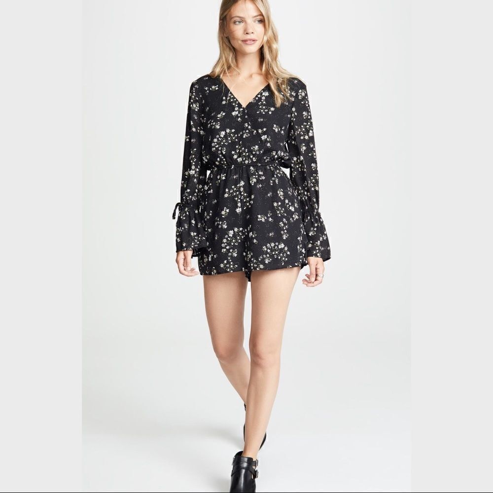 Cupcakes and Cashmere Black Floral Romper. Size Medium. New With Tags. NWT.